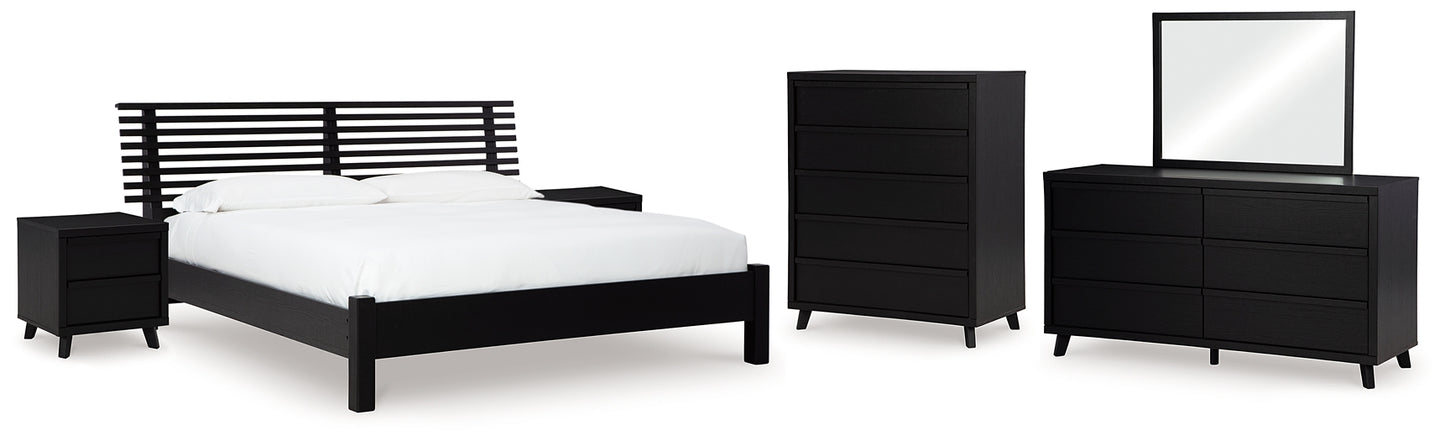 Danziar King Panel Bed with Mirrored Dresser, Chest and 2 Nightstands